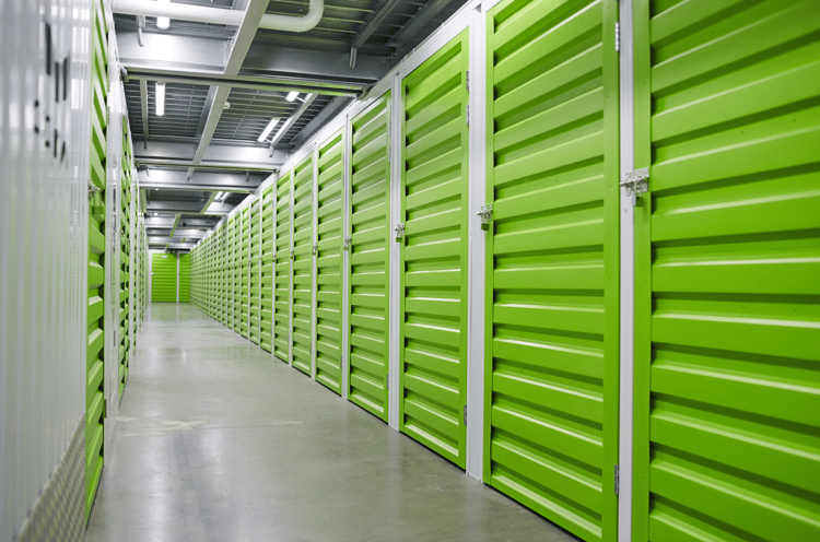 modern warehouse with green storage boxes for storage